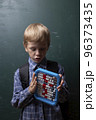 Child tries to solve mathematical problem with abacus. 96373435
