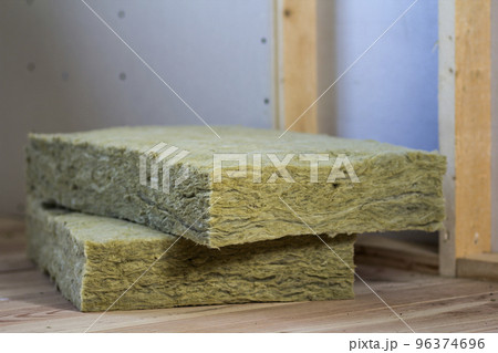 Wooden frame for future walls with drywall plates insulated with rock wool and fiberglass insulation staff for cold barrier. Comfortable warm home, economy, construction and renovation concept. 96374696