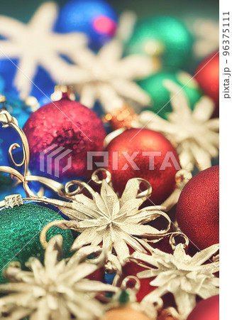 Macro shot of colorful Christmas Ornaments. Pile of Christmas festive decorations stock photo. 96375111