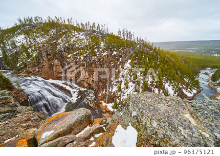 Wide angle on cliffs of stunning Gibbon Falls in Yellowstone 96375121