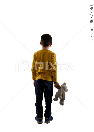 Child with teddybear in hand isolated on white background 96377063