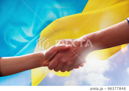 Sunny Ukraine country flag with helping hand as support Sunny Ukraine country flag with helping hand as support 96377848