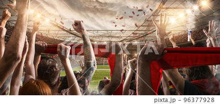 Football scene with cheering audience at the stadium 96377928