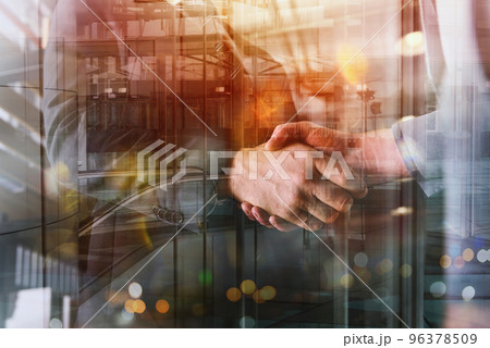Handshaking of business person in office as teamwork and partnership 96378509