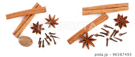 Cinnamon sticks with star anise, nutmeg and clove isolated on white background. Top view 96387493