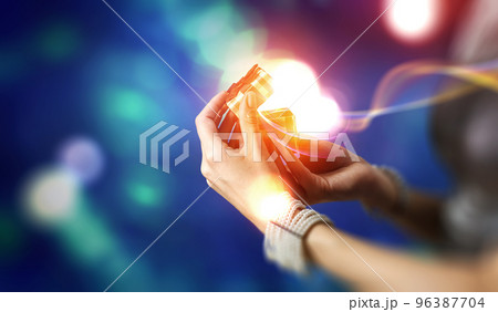 Closeup hands giving surprise gift box Closeup hands giving surprise gift box 96387704