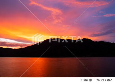 Sunset or sunrise sky clouds over mountains,Beautiful reflex sunset or sunrise light in water surface,Amazing nature landscape Colorful sky clouds background 96393302