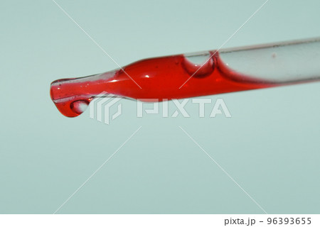 The last drop in the pipette of blood. The concept of developing a pharmaceutical drug for the treatment of diseases with the help of drugs that improve DNA. High quality photo 96393655