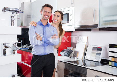 Pair standing in furniture accessories store 96393889