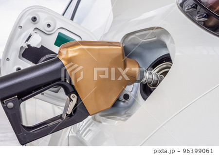 White car refueling at petrol gas station White car refueling at petrol gas station 96399061