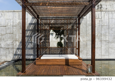 slats roof, architecture construction with sunlight streaming through making beautiful shadow lines. 96399432