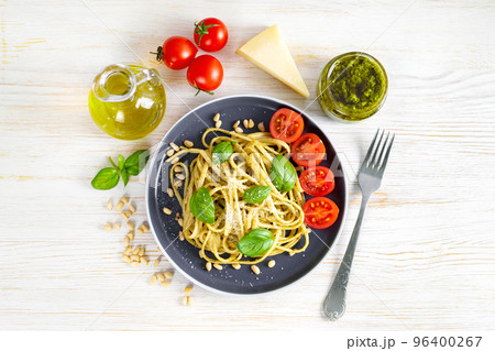 Pasta with fresh homemade pesto sauce and food ingredients Pasta with fresh homemade pesto sauce and food ingredients 96400267