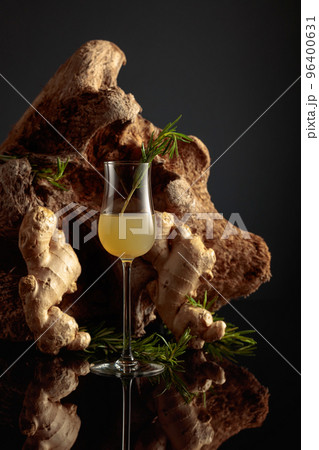 Ginger liquor with a rosemary branch. 96400631