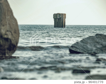 Ruins of the old gauge tower on shore bellow Cape Arkona cliff 96401770