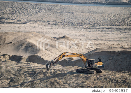 Excavator Machine at Excavation Earthmoving in Sand Desert Quarry. Construction Industry concept. 96402957