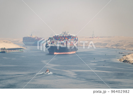 Many cargo ships navigate through Suez Canal. Shipping canal in Egypt. Concept of transportation and logistics  96402982