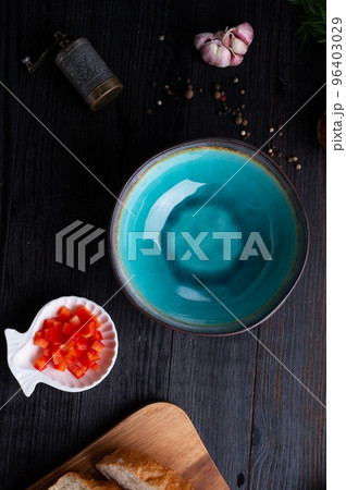 blue nice bowl and ingredients served at dark wooden table. meditarranean cuisine. flat lay 96403029