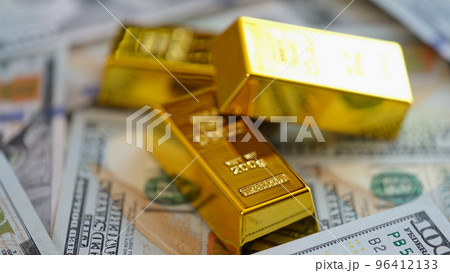 Gold bars on US dollar banknotes background. Gold bars on US dollar banknotes background. 96412133