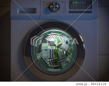Dirty money laundering concept. Euro packs laundering in washing machine under clioud of night. 96416126