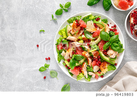 Salad salmon with avocado, grapefruit and pomegranate. Healthy food. Ketogenic, keto or paleo diet lunch bowl. Top view 96419803