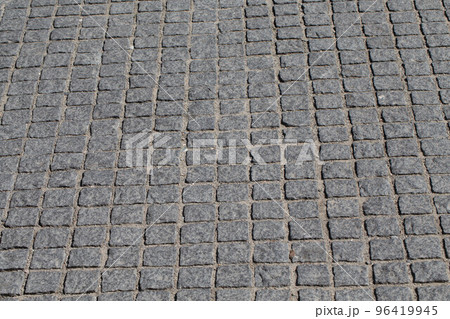 Old stone paved avenue street 96419945