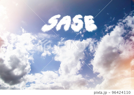 Sase. Text from clouds in sky in bright sunlight. 96424110