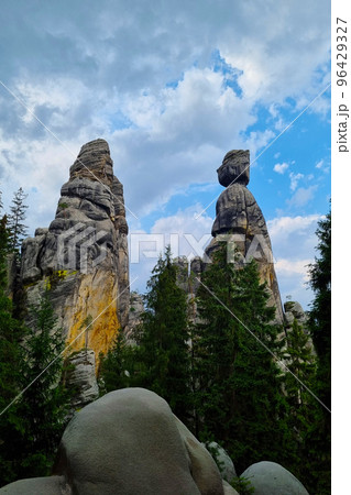 Beautiful rocks in the forest against the blue sky. Beautiful rocks in the forest against the blue sky. 96429327