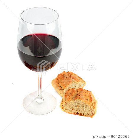 A glass of red wine and baguette isolated on a white. Free space for text. A glass of red wine and baguette isolated on a white. Free space for text. 96429363