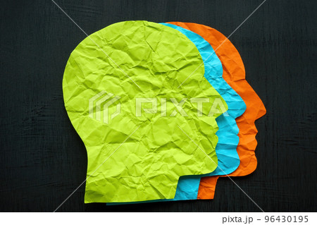 Heads on a dark surface made of colored paper. Diversity and inclusion concept. 96430195