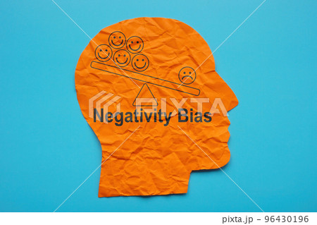 Head from paper and inscription Negativity bias. 96430196