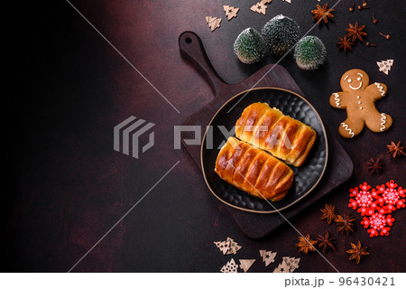 Sweet tasty fresh festive baking on a dark concrete background Sweet tasty fresh festive baking on a dark concrete background 96430421