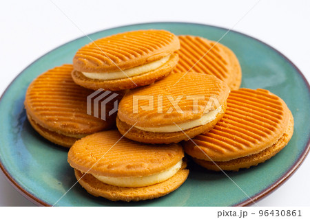 Custard cream sandwich biscuits on white background. Custard cream sandwich biscuits on white background. 96430861