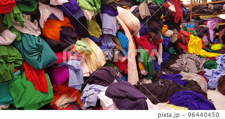 multi colored pile of fabrics, fabric for sewing clothing, fashionable fabric and textile multi colored pile of fabrics, fabric for sewing clothing, fashionable fabric and textile 96440450