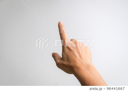 Male hand with index finger pointing to something. Male hand with index finger pointing to something. 96441667