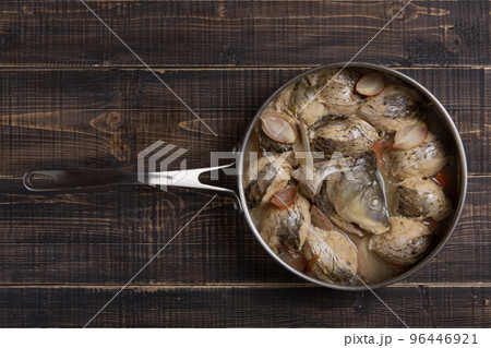 Large frying pan with ready-made fish meatballs or cutlets, on a wooden table, copy space Large frying pan with ready-made fish meatballs or cutlets, on a wooden table, copy space 96446921
