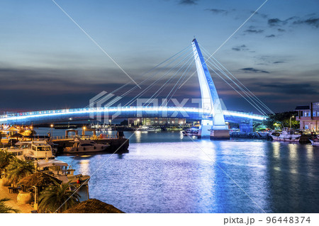 Sunset view of Lover's Bridg at Tamsui Fisherman's Wharf in New Taipei City, Taiwan. is a white Cable-stayed bridge. Sunset view of Lover's Bridg at Tamsui Fisherman's Wharf in New Taipei City, Taiwan. is a white Cable-stayed bridge. 96448374