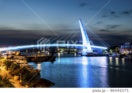 Sunset view of Lover's Bridg at Tamsui Fisherman's Wharf in New Taipei City, Taiwan. is a white Cable-stayed bridge. Sunset view of Lover's Bridg at Tamsui Fisherman's Wharf in New Taipei City, Taiwan. is a white Cable-stayed bridge. 96448375