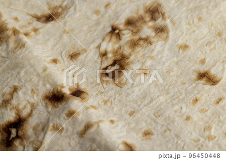 Wheat pita bread with dark spots 96450448