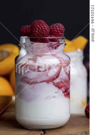 yogurt with fresh berries and raspberry jam 96450521
