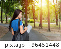 Woman going to exercise in the garden. 96451448