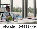 Senior businessman sitting at his desk. 96451449