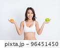 Portrait woman holding green apple. 96451450