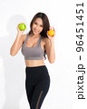 Portrait woman holding green apple and orange. 96451451