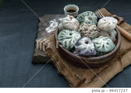 Chinese chives Dumplings Mixed Color or Garlic Chives Dim Sum Rice Cake inside with Taro Slice ,Bamboo shoot and Many kind of vegetable inside the flour, Steamed Served Sweet Black Soy Sauce Chinese 96457237