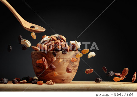 Flying dried fruits and nuts. 96457334