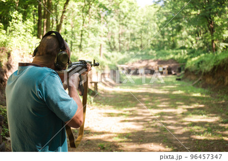 A Ukrainian man is training to shoot an Akm 96457347