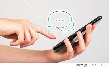 Forefinger swiping positive comments on phone. Consumer, client satisfaction. Good feedback on social media. Woman holding smartphone and reading messages Forefinger swiping positive comments on phone. Consumer, client satisfaction. Good feedback on social media. Woman holding smartphone and reading messages 96458490