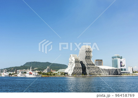 Building view of Kaohsiung Music Center in Port of Kaohsiung, Taiwan. The white hexagonal building structure on the shore of love pier. 96458769