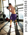 Handsome Athletic Men Exercising With Kettlebell in the gym 96458848