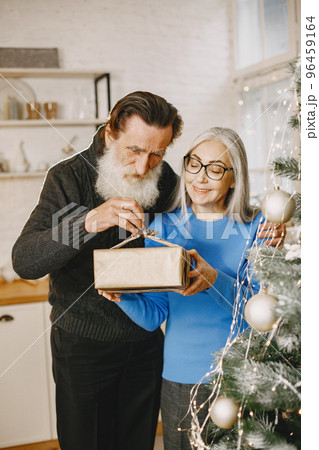 Age and people concept . Senior couple at home. Woman in a blue knited sweater. 96459164